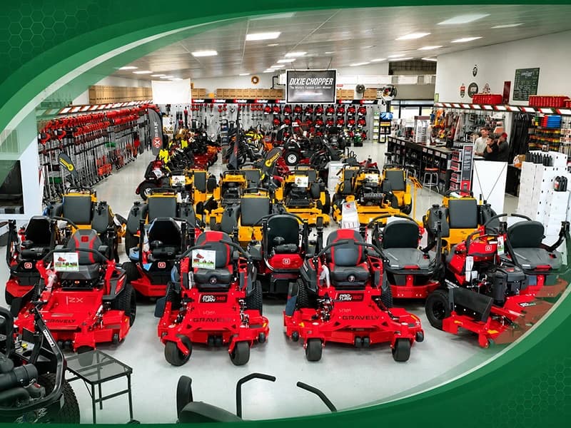 Zero-turn mowers inside of an OPE dealership.