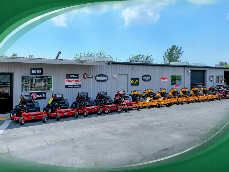 Zero-turn mowers outside of an OPE dealership.